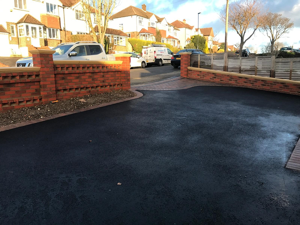 Completed tarmac driveway with block paving apron